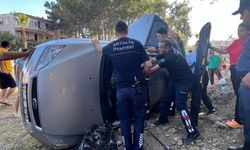 Hamile kadın takla atan otomobilde sıkıştı
